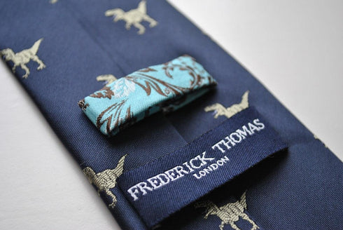 navy blue tie with t-rex dinosaur print design